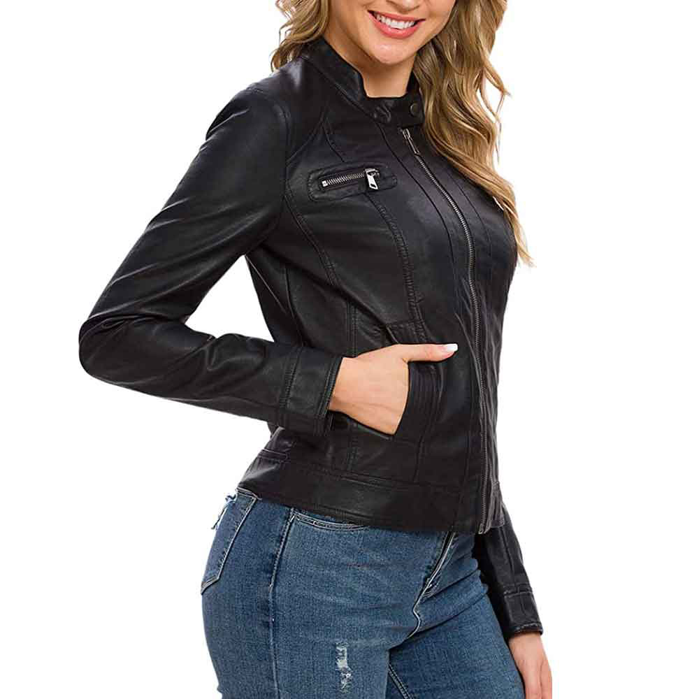 Fashionable woman showcasing all-match style with black leather jacket and jeans