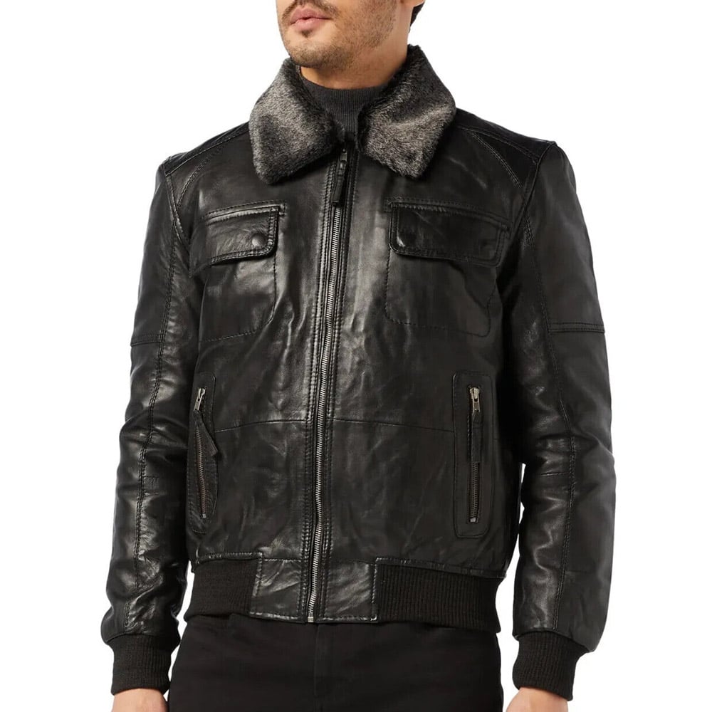 Close-up of a black lambskin leather bomber jacket with a fur collar