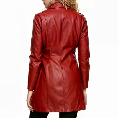 A model wearing the Buffy the Vampire Slayer leather jacket, showcasing its long, bold red design and high-quality leather material