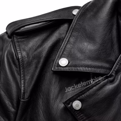 Upper portion of black leather motorcycle jacket showing collar and lapels