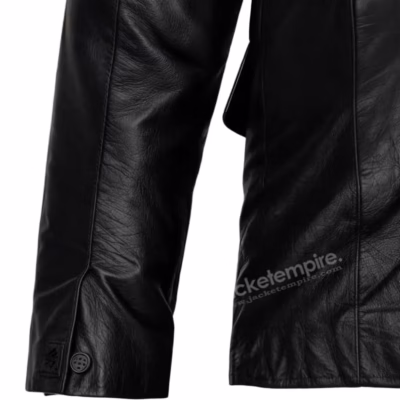 Close-up of leather blazer sleeve detail and button finishing