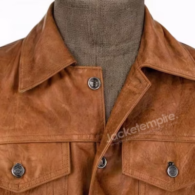 Close-up of tan leather jacket collar and chest pocket details